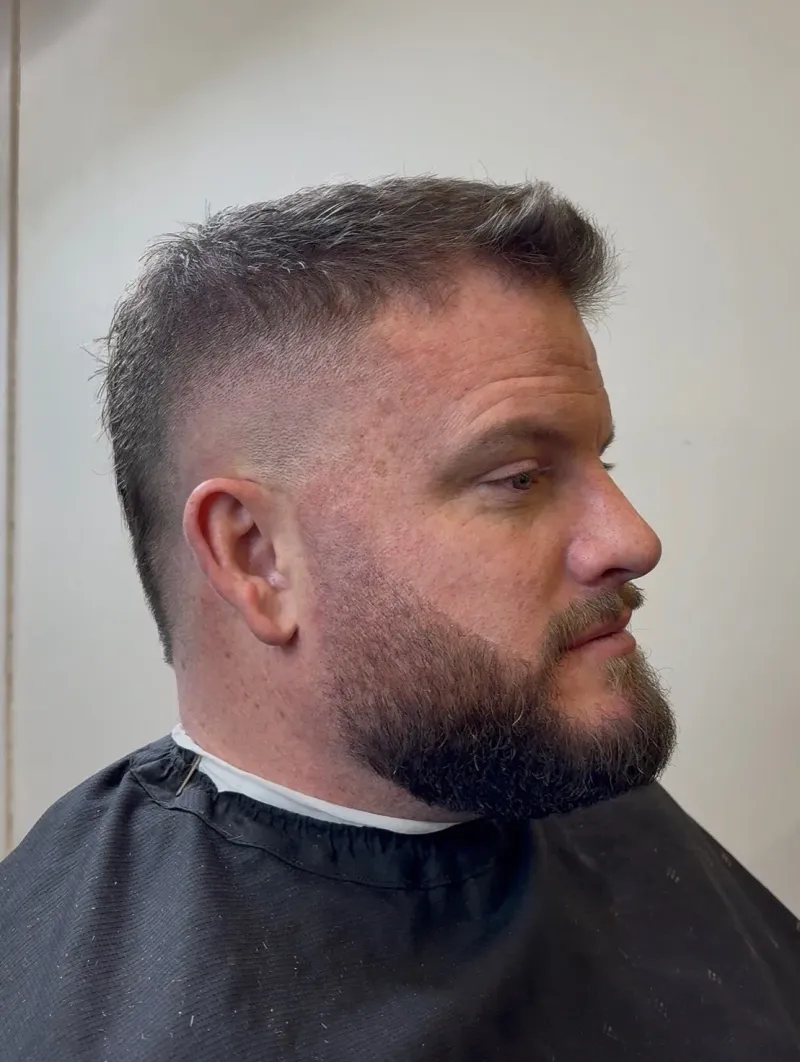 Same client after a high-fade haircut and beard line-up.