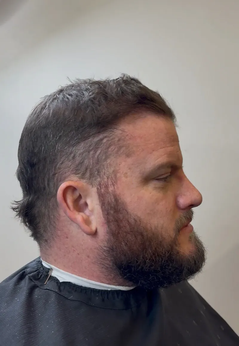 Client before a haircut and beard refresh at Main Street Barbers.