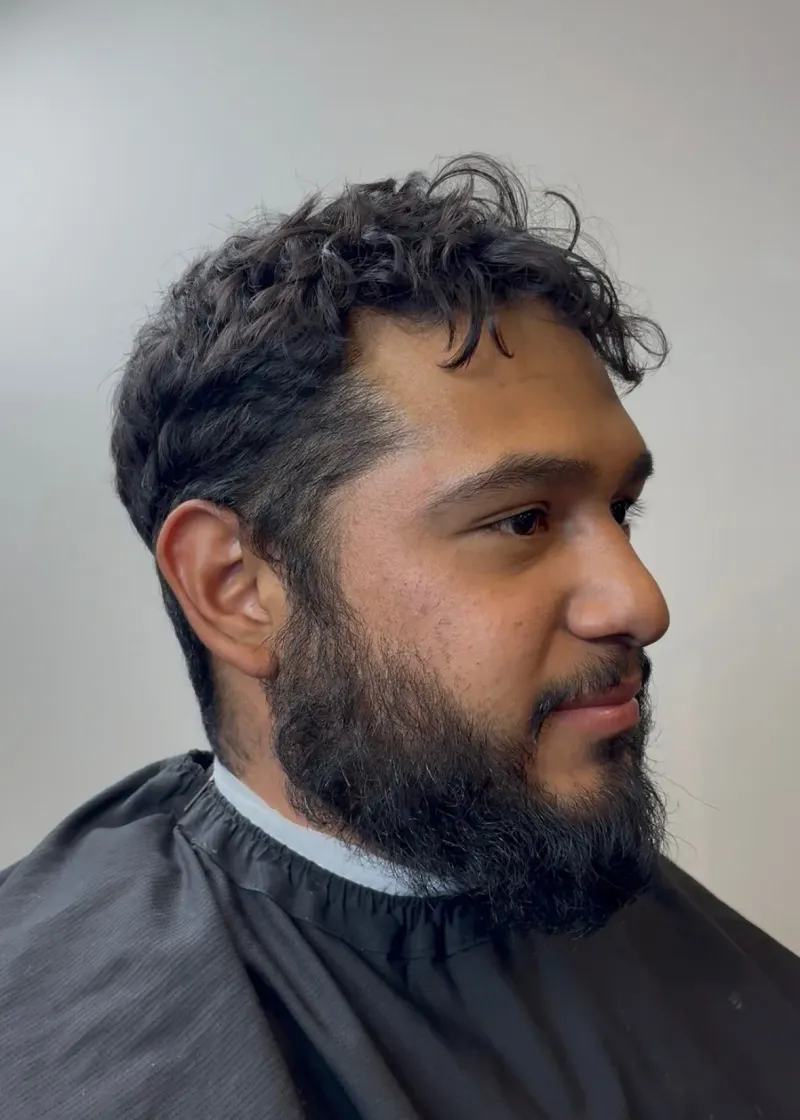Client before a haircut at Main Street Barbers.