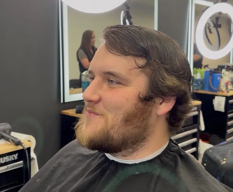 Client before a fade and beard trim at Main Street Barbers.